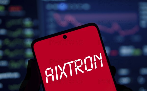 AIXTRON logo is displayed on smartphone. Aixtron SE is a European multinational technology company.