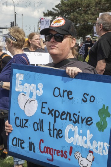 Warren, Michigan USA - 29 April 2025 - Thousands of protesters showed up to 'unwelcome' President Donald Trump who celebrated his first 100 days in office with a rally at Macomb Community College. The protesters cited government funding cuts which have cost jobs, health care, retirement, and more