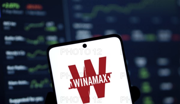 Winamax logo is displayed on smartphone. Winamax is a French gambling company
