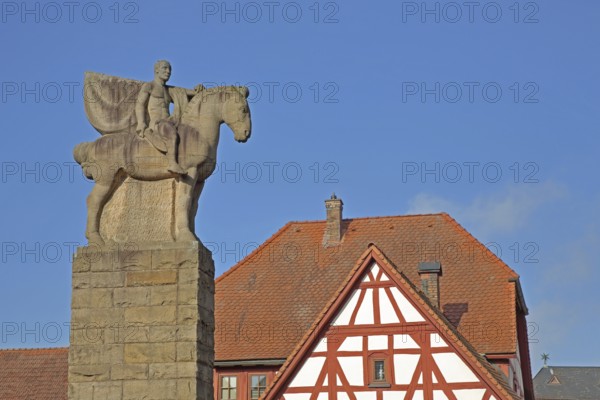 War memorial with equestrian figure from World War 1, equestrian statue, horse figure, half-timbered house, column, Göllheim, Rhineland-Palatinate, Germany