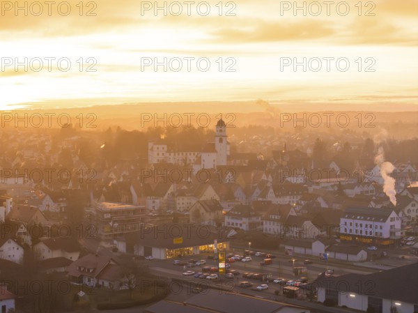 Panorama of a town at dusk, bathed in warm colours by the sunset, Meßkirch, Sigmaringen district, Germany