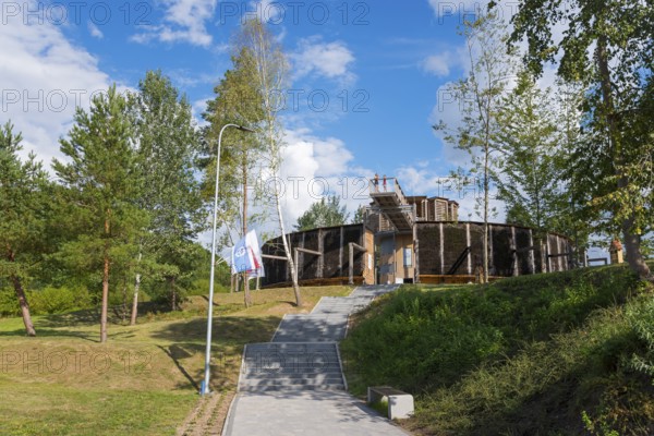 Round wooden building surrounded by trees, in sunny weather and clear sky, brine, graduation tower, spa town of Milomlyn, Milomlyn, Lviv, Warmia-Mazury, Poland