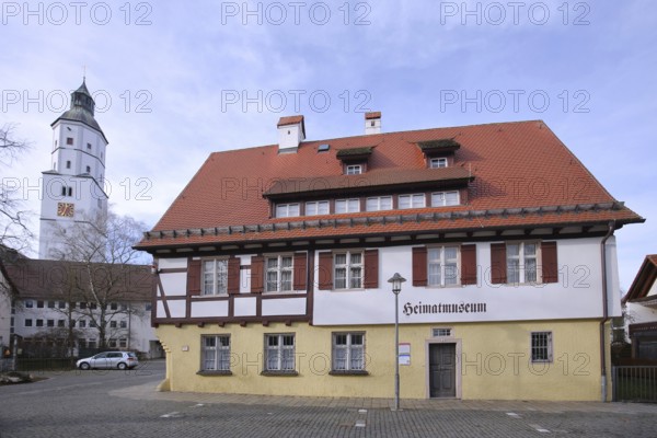Local history museum built in the 16th century and church tower of St Martin's Church, landmark, half-timbered house with inscription, Langenau, Alb-Donau district, Swabian Alb, Baden-Württemberg, Germany