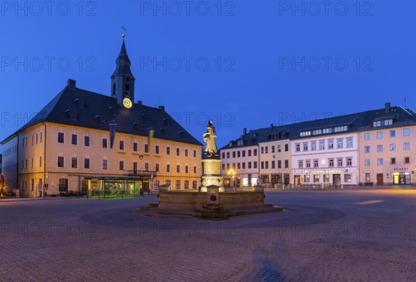 Twilight shot of the town hall on the market square with Barbara Uthmann fountain, Annaberg-Buchholz, Erzgebirge, Saxony, Germany