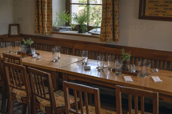 Empty beer glasses and receipts on pub tables, Bavaria, Germany