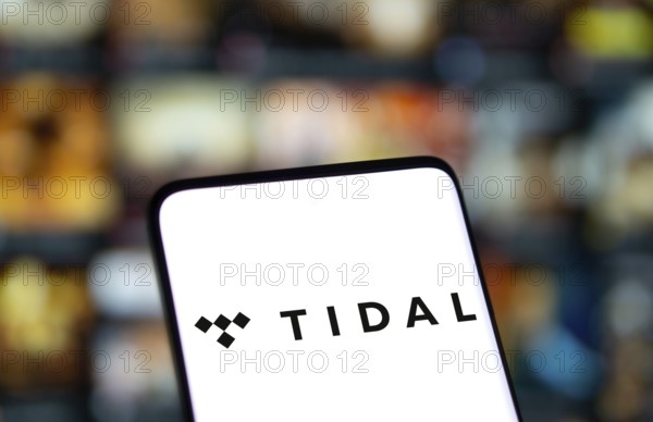 Tidal logo is displayed on smartphone. Tidal is a Norwegian-American music streaming service company