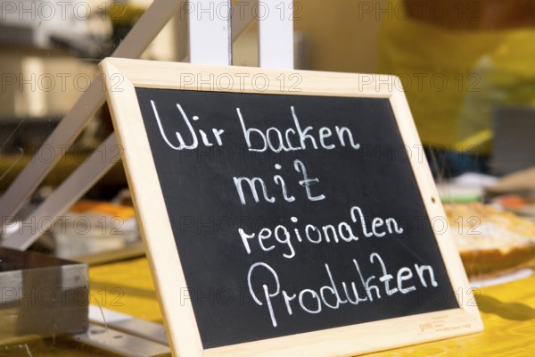 Sign with the inscription We bake with regional products, products from the region, organic products