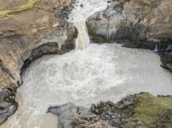 Aerial view of waterfall Aldeyarfoss, canyon of volcanic basalt columns, Þingeyjarsveit, Norðurland eystra, Iceland