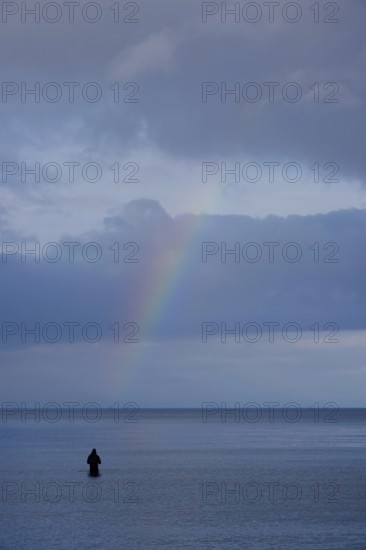Angler and rainbow, Baltic Sea, Mecklenburg-Western Pomerania, Germany