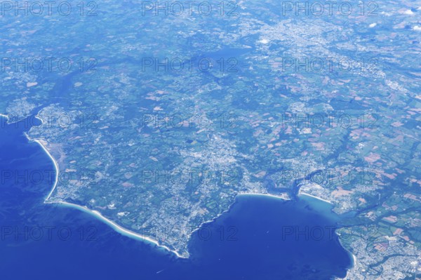 Oblique aerial view from plane window of coastline of Fouesnant, near Quimper, Brittany, France