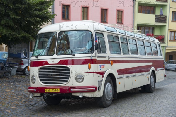 A classic old bus on a cobbled street in a town with colourful buildings, vintage car, Skoda 706 RTO Lux, Úštek, Ustek, Auscha, Ústecký kraj, Litomerice district, Czech Republic