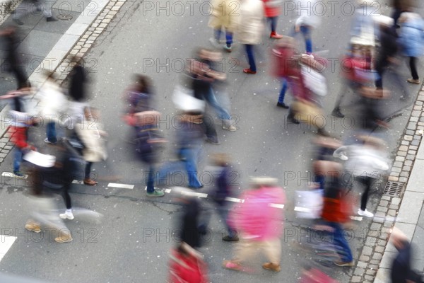 Passers-by crossing a street, long exposure, Germany
