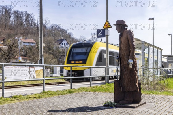 Georg Elser memorial at Königsbronn railway station. The statue by Friedrich Frankowitsch shows the resistance fighter Elser ready to travel with sticks of dynamite in his suitcase, waiting for a train on the Brenzbahn towards Munich. Königsbronn, Baden-Württemberg, Germany