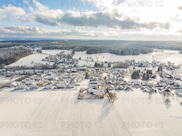 Snowy landscape with a village surrounded by fields and forests, Oberreichenbach, Black Forest, Calw district, Germany