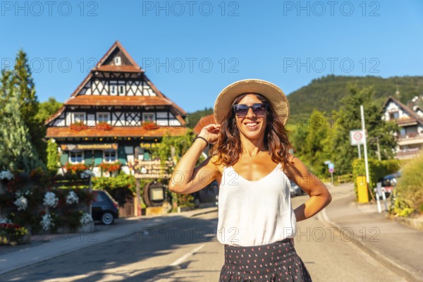 Portrait of a female tourist in the medieval mountain village of Sasbachwalden, Black Forest, Germany