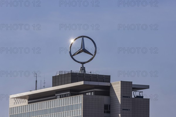 Mercedes star with sun star. Building at the headquarters of Mercedes-Benz Group AG in Untertürkheim, Stuttgart, Baden-Württemberg, Germany