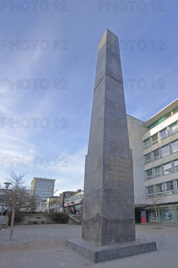 Obelisk and artwork The Strangers and Refugees Monument by Olu Oguibe 2017, documenta 14, building and pedestrian, symbol for discrimination and refugees, harbours, harbouring, stranger, stranger, foreigner, refugees, refugee, outsider, asylum, help, aid, inscription, writing, pedestrian zone, Treppenstraße, Kassel, Hesse, Germany