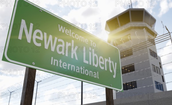 Newark liberty international airport green road sign in front of air traffic control tower
