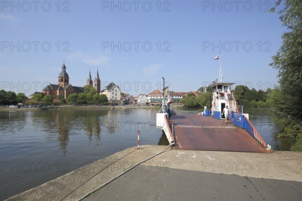 View of the Main and Einhard Basilica of St. Marcellinus and Peter, ferry, monastery complex, Seligenstadt, Main, Hesse, Germany