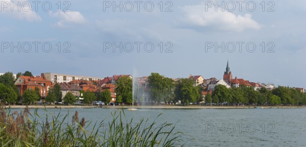 Panorama of a lakeside town with church tower and trees, central fountain, summer scenery, Elk, Elk, Lyck, Jezioro Elckie, Warmia-Masuria, Poland