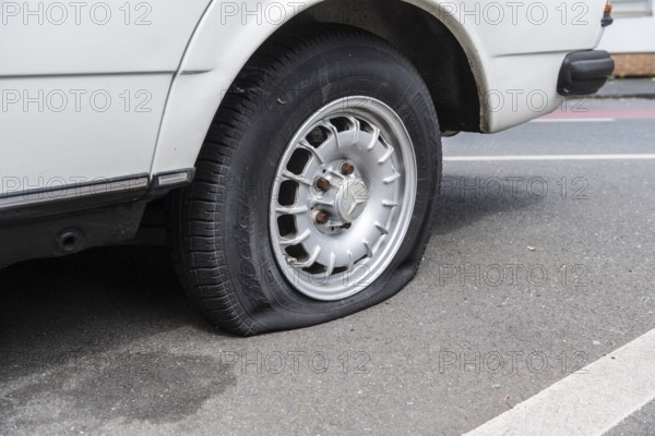 A flat tyre on a car, Wuppertal, Germany