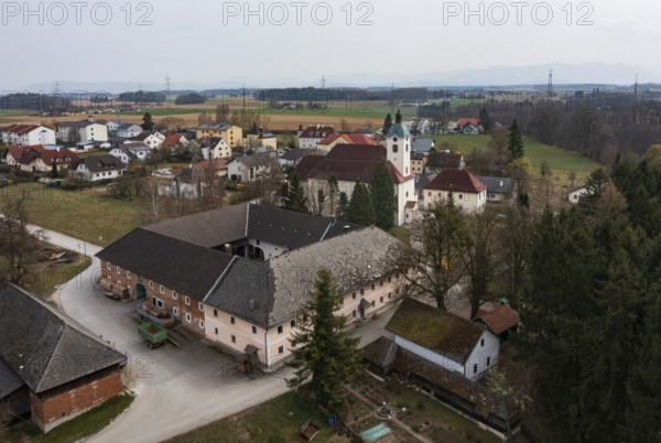 Drone shot, view of village, parish church, Schiedlberg Traunviertel, Upper Austria, Austria