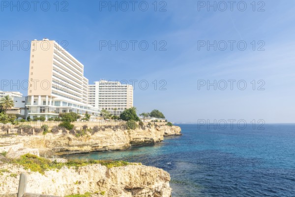 Breathtaking hotels perched on a cliff overlooking the turquoise mediterranean waters in cales de mallorca, manacor