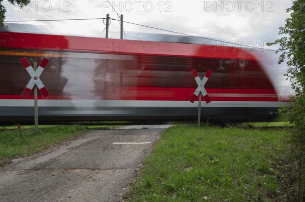 Passing Gräfenberg railway, single-track branch line, at the unrestricted level crossing, Igensdorf, Upper Franconia, Bavaria, Germany