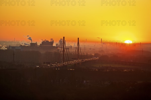 Atmospheric view of the ThyssenKrupp plant with the A 42 motorway at sunrise, Duisburg, North Rhine-Westphalia, Germany