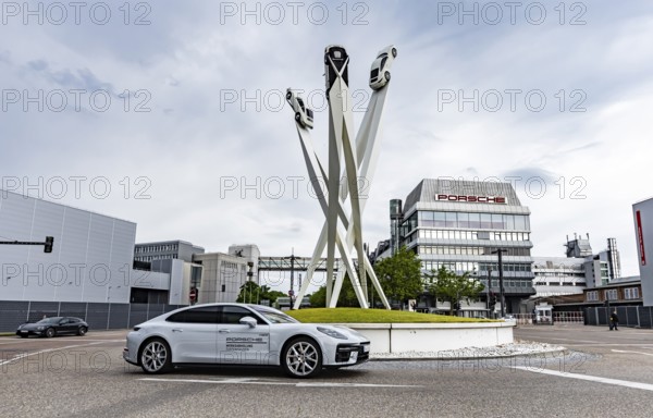 Porscheplatz Zuffenhausen with Porsche headquarters. Artwork Inspiration 911 by Gerry Judah with three steles, each presenting a Porsche 911. Stuttgart, Baden-Württemberg, Germany