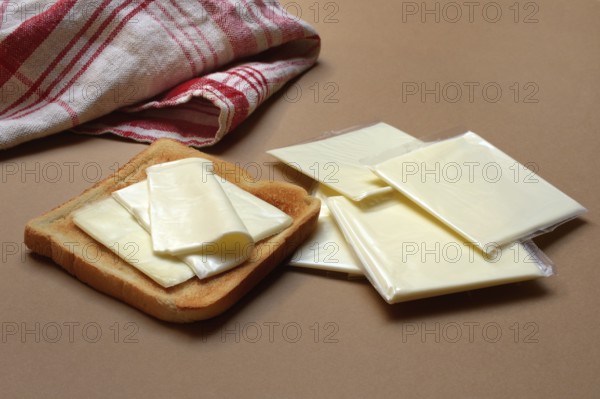 Cheese slices with toast, processed cheese in packaging