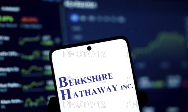Berkshire Hathaway inc logo is displayed on smartphone. Berkshire Hathaway Inc is an American multinational conglomerate holding company