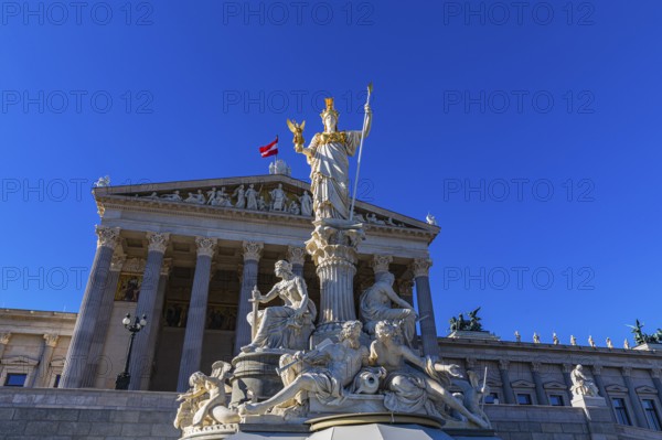 Pallas-Athena Fountain, The goddess of wisdom, holding a spear in her left hand, the goddess of victory Nike in her right hand, behind her the building of the parliament, Vienna, Austria