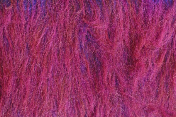 Close up of bright red and purple synthetic fake fur