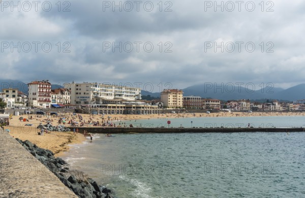 Summer in the Grande Plage in Saint Jean de Luz, holidays in the south of France, French Basque Country. France