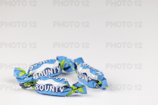 Three Bounty, small chocolate bars on a white background