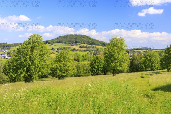 Town and mountain Bärenstein in the Ore Mountains, in the background the Pöhlberg, view from Weipert in the Czech Republic