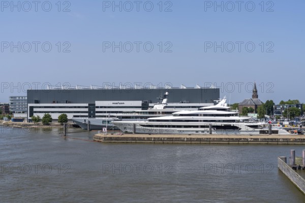 Oceanco shipyard in Alblasserdam, specialising in the construction of mega yachts, luxury yachts, on the river Noord, South Holland, in front the H3 yacht, 105 metres long, completely renovated, rebuilt, behind the superyacht Seven Seas Yacht, 109 metres long, owned by Steven Spielberg, Netherlands