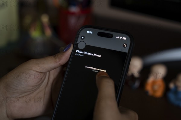 In this photo illustration, a person browsing Xinhua News Agency X account as India bans Chinese state media Xinhua, in Guwahati, India on 14 May 2025. India has blocked the X (formerly Twitter) accounts of Chinese state-run media outlets Xinhua News Agency and Global Times due to their dissemination of unverified and misleading information concerning the Indian armed forces amid heightened tensions between India and Pakistan