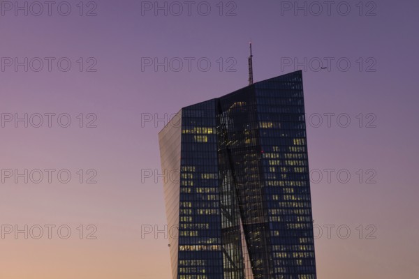 The lights in the offices of the European Central Bank (ECB) in Frankfurt am Main shine in the evening, Frankfurt am Main, Osthafen, Hesse, Germany