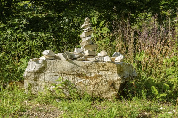 Cairn to mark the edge of the path, near the Schertelshöhle cave, Swabian Alb, Germany