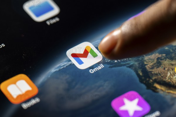 In this photo Illustration a person taps Gmail App icon on a tablet device on 24 May 2025 in New Delhi, India