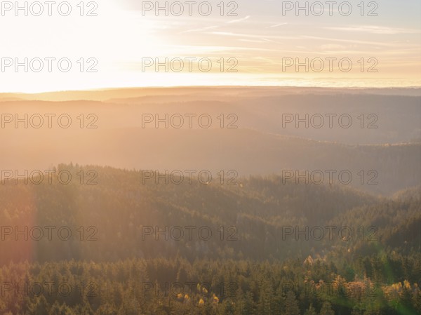 Light play of the sunrise over the wooded hills, quiet expanse, Black Forest, Germany