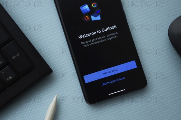 Dhaka, Bangladesh - 17 March 2025: The app of the microsoft outlook is displayed on a smartphone screen