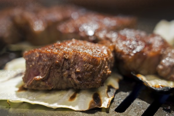 Japanese wagyu meat, steak, expensive delicacy also called Matsusaka beef, Kobe beef, Yonezawa beef on the grill, Tokyo, Japan