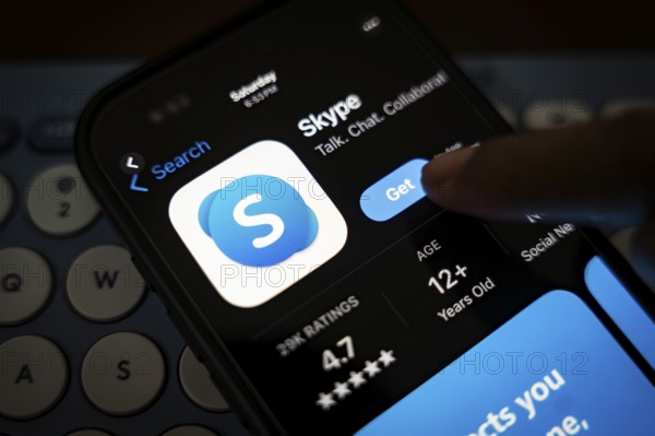 In this photo illustration, a person holds a mobile phone displaying Skype application, in Guwahati, India on 3 March 2025. Skype is shutting down in May 2025, and Microsoft is moving users to Teams