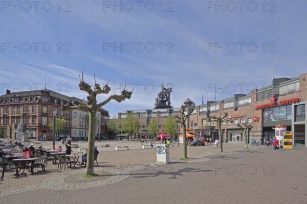 Street pub at Stummplatz and Altes HüttenAreal, former ironworks, ironworks, blast furnace, industrial monument, cultural monument, people, seating, tables, sitting, pedestrian zone, houses, blast furnace, Saarland, Neunkirchen, Germany