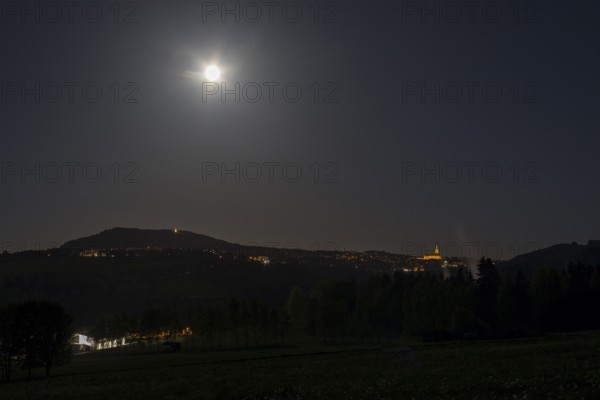 View from north to Pöhlberg and Annaberg-Buchholz with St.-Annen church, full moon night, Erzgebirge, Saxony, Germany