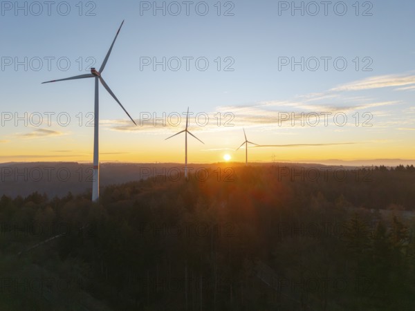 Tranquil landscape with wind turbines at sunrise over wooded area, wind farm, Rems Valley, Baden-Württemberg, Germany