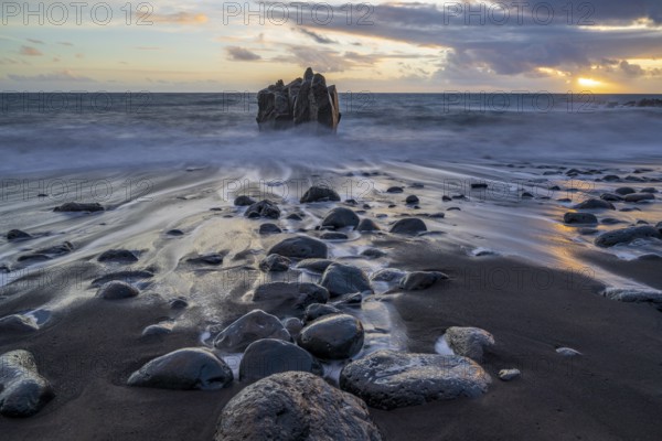 Sunset, waves and rocks in the sea, Praia Formosa, Madeira, Portugal
